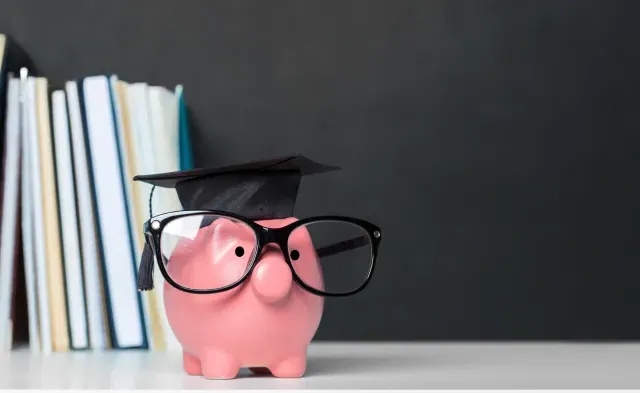 College graduate student diploma piggy bank